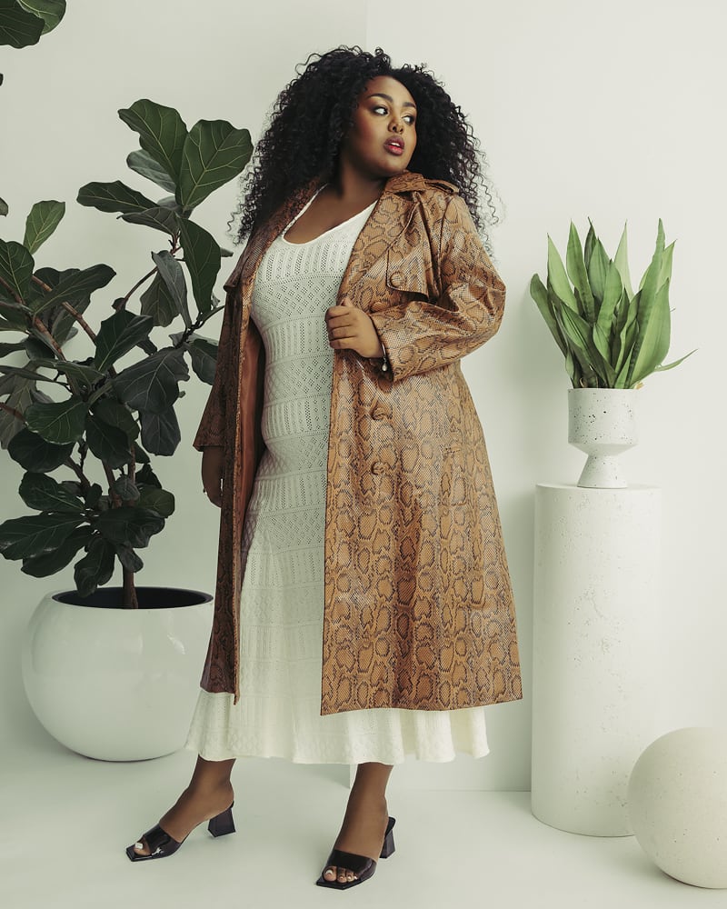 Front of a model wearing a size 2X Snakeskin Trench Coat in Brown by Hilary MacMillan. | dia_product_style_image_id:314066